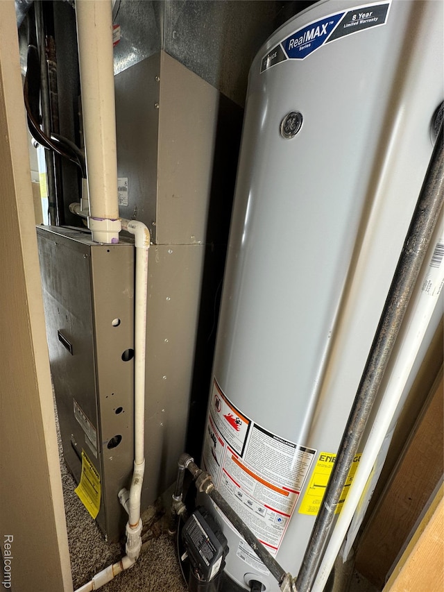 47151 Admirals Cove Ln Unit 1, Chesterfield, MI 48051 - utility room featuring gas water heater and heating unit