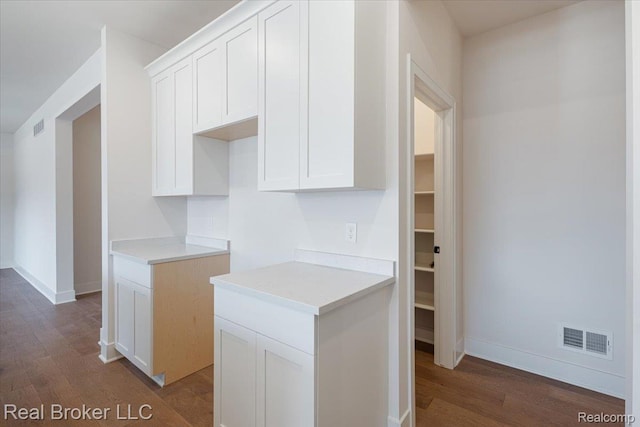 35704 Addison Dr, New Baltimore, MI 48047 - kitchen featuring dark wood finished floors, light countertops, and white cabinetry