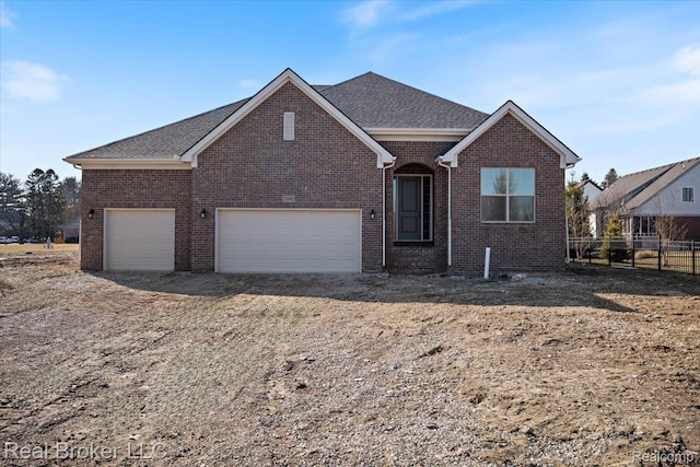35704 Addison Dr, New Baltimore, MI 48047 - view of front of property with brick siding, a garage, and a shingled roof