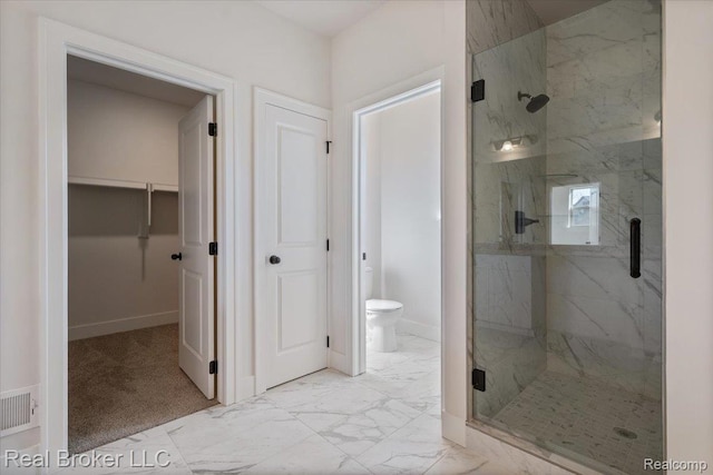 35704 Addison Dr, New Baltimore, MI 48047 - bathroom featuring a marble finish shower, toilet, baseboards, and marble finish flooring