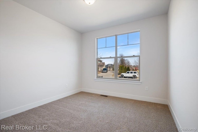 35704 Addison Dr, New Baltimore, MI 48047 - spare room featuring carpet and baseboards