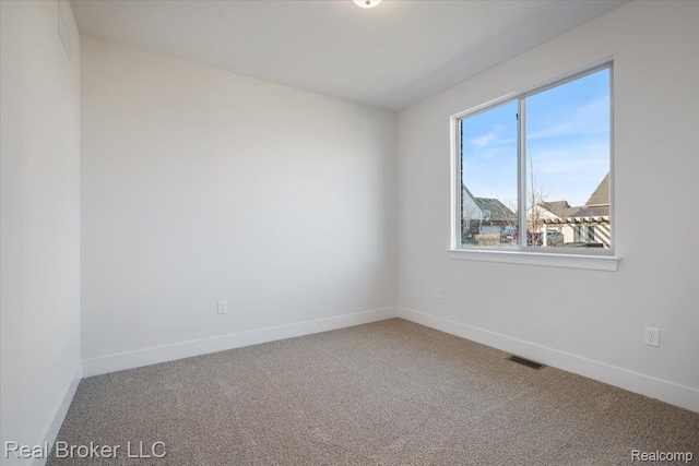 35704 Addison Dr, New Baltimore, MI 48047 - carpeted empty room with baseboards