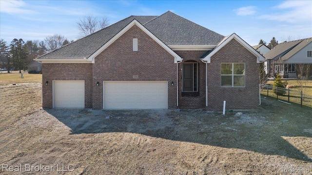 35704 Addison Dr, New Baltimore, MI 48047 - view of front facade featuring brick siding, a garage, and a shingled roof