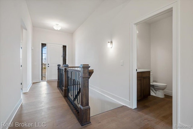 35704 Addison Dr, New Baltimore, MI 48047 - corridor featuring an upstairs landing, wood finished floors, and baseboards