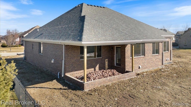 35704 Addison Dr, New Baltimore, MI 48047 - back of house with brick siding and roof with shingles