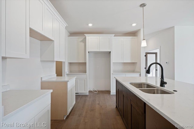 35704 Addison Dr, New Baltimore, MI 48047 - kitchen featuring a sink, light stone counters, white cabinets, wood finished floors, and hanging light fixtures