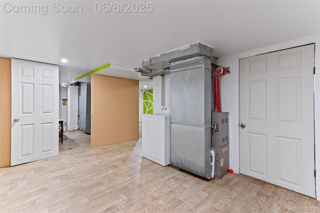 5839 Mcmillan St, Allen Park, MI 48209 - finished below grade area featuring washer / dryer and light wood-type flooring