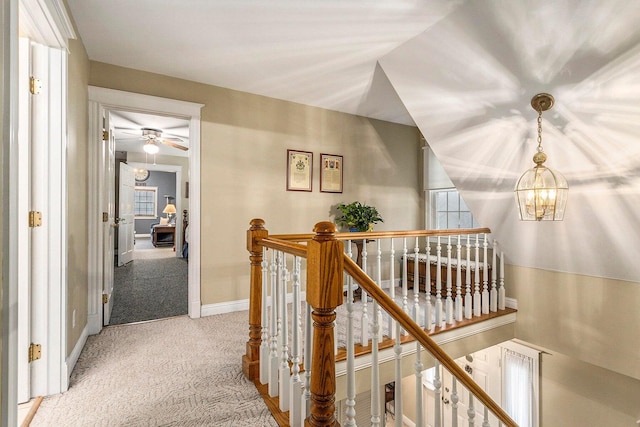 3313 Gethings Rd, Battle Creek, MI 49015 - corridor featuring an upstairs landing, carpet, a chandelier, and baseboards