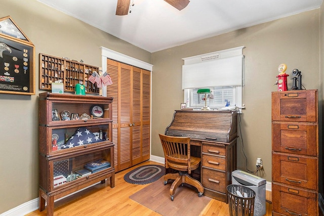 3313 Gethings Rd, Battle Creek, MI 49015 - home office featuring wood finished floors, ceiling fan, and baseboards