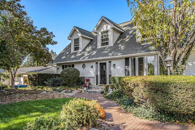 3313 Gethings Rd, Battle Creek, MI 49015 - cape cod home featuring roof with shingles
