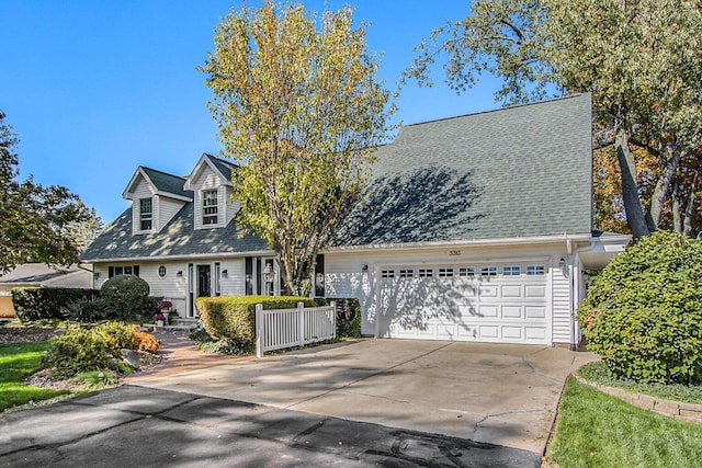 3313 Gethings Rd, Battle Creek, MI 49015 - new england style home featuring concrete driveway and a garage