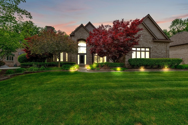 482 Torrington Dr W, Canton, MI 48188 - french country style house with a front yard and brick siding