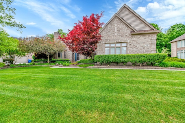 482 Torrington Dr W, Canton, MI 48188 - view of front of house with a front yard and brick siding