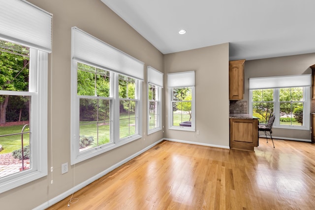 482 Torrington Dr W, Canton, MI 48188 - unfurnished living room featuring plenty of natural light, light wood-style flooring, and baseboards