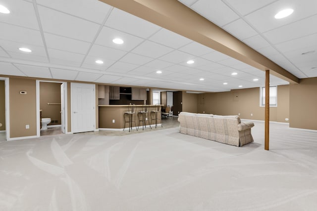 482 Torrington Dr W, Canton, MI 48188 - living area with light carpet, bar, recessed lighting, baseboards, and a paneled ceiling