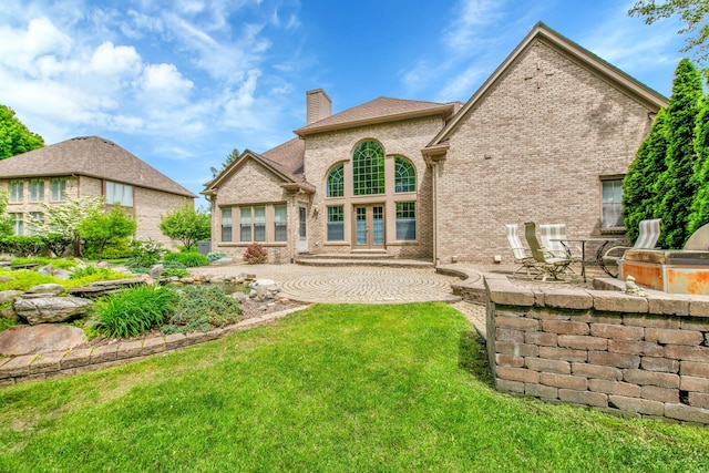 482 Torrington Dr W, Canton, MI 48188 - rear view of property with a chimney, a patio, a lawn, and brick siding