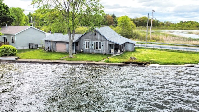 10920 Dwight St, Chippewa Lake, MI 49320 - back of property with a water view and an attached garage