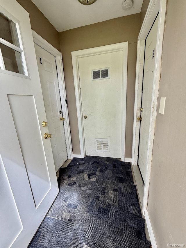 2243 Noble Ave, Flint, MI 48532 - entryway featuring carpet flooring and baseboards