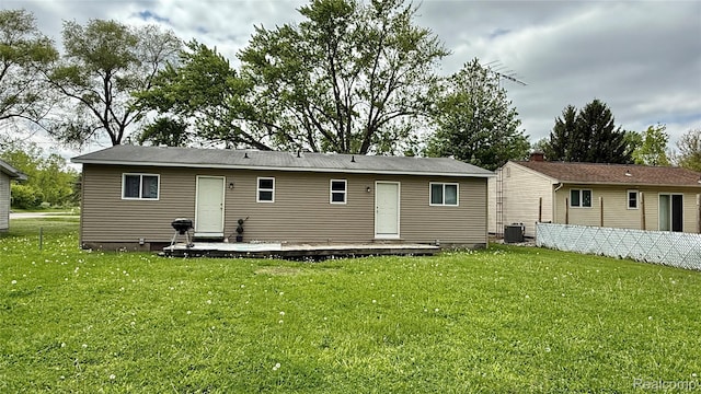 2243 Noble Ave, Flint, MI 48532 - back of property featuring a yard, cooling unit, and a patio