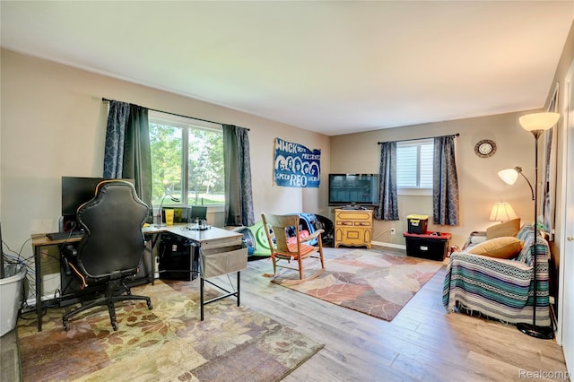2243 Noble Ave, Flint, MI 48532 - living area featuring wood finished floors and a desk