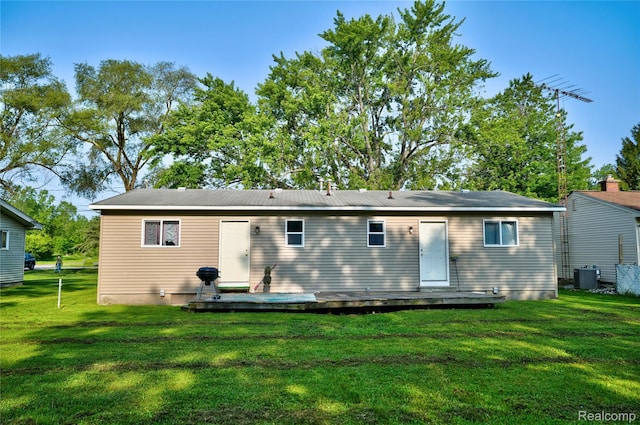 2243 Noble Ave, Flint, MI 48532 - rear view of property with a yard and a wooden deck