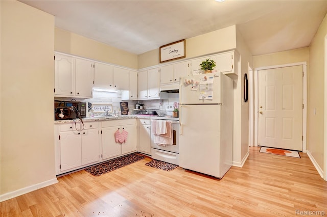 2243 Noble Ave, Flint, MI 48532 - kitchen with white appliances, light wood-type flooring, a sink, white cabinets, and backsplash