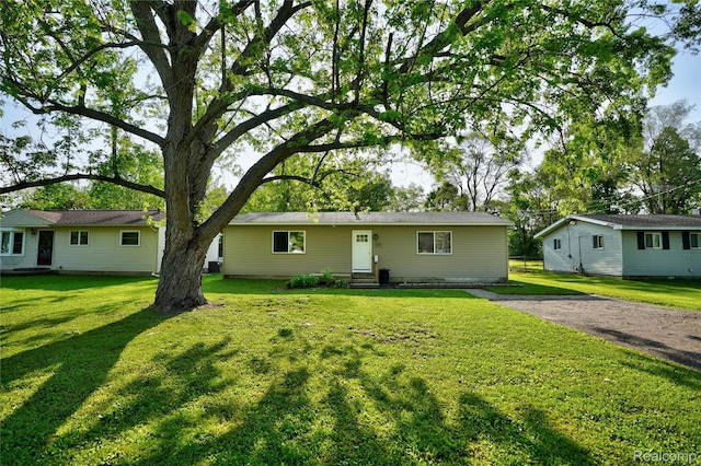 2243 Noble Ave, Flint, MI 48532 - ranch-style house with entry steps and a front yard
