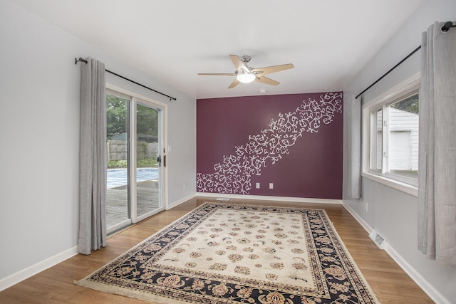2013 Cumberland St, Kalamazoo, MI 49006 - empty room featuring ceiling fan, light wood finished floors, and baseboards