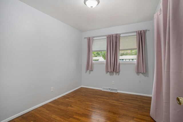2013 Cumberland St, Kalamazoo, MI 49006 - spare room featuring baseboards and wood finished floors