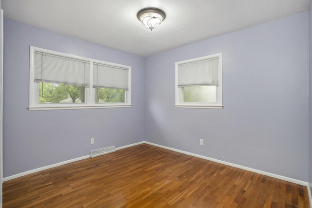 2013 Cumberland St, Kalamazoo, MI 49006 - unfurnished room featuring baseboards and wood finished floors
