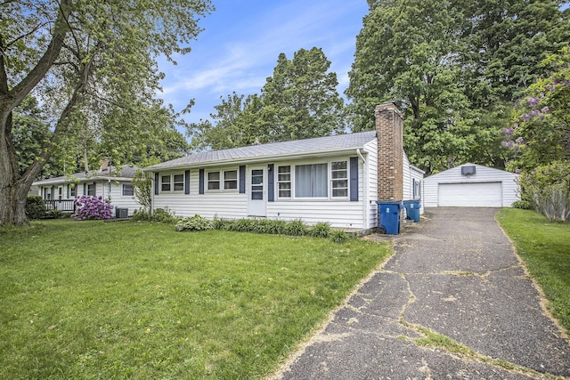 2013 Cumberland St, Kalamazoo, MI 49006 - single story home featuring a chimney, an outbuilding, a detached garage, a front yard, and central AC