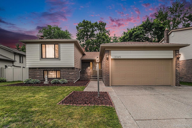 3365 Gloucester Dr, Sterling Heights, MI 48310 - split level home featuring brick siding, driveway, and an attached garage