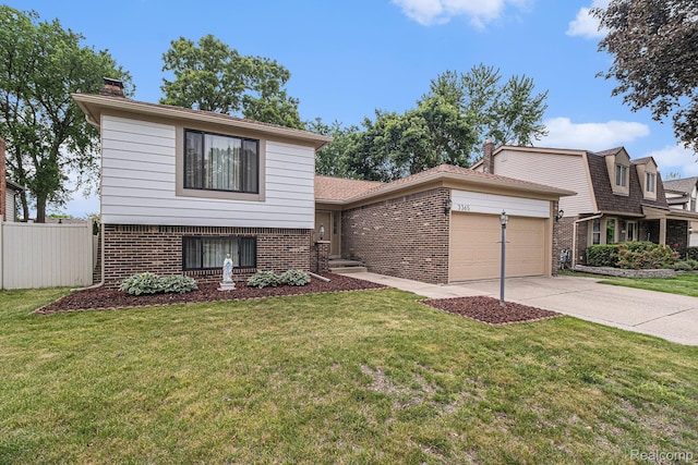 3365 Gloucester Dr, Sterling Heights, MI 48310 - view of front of home featuring brick siding, an attached garage, driveway, and a chimney