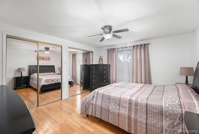 3365 Gloucester Dr, Sterling Heights, MI 48310 - bedroom with multiple closets, light wood-type flooring, and ceiling fan