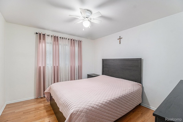 3365 Gloucester Dr, Sterling Heights, MI 48310 - bedroom with wood finished floors, baseboards, and a ceiling fan