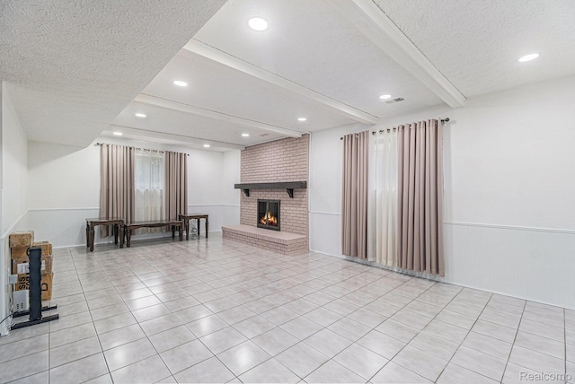 3365 Gloucester Dr, Sterling Heights, MI 48310 - living area featuring a textured ceiling, beamed ceiling, light tile patterned floors, a brick fireplace, and recessed lighting