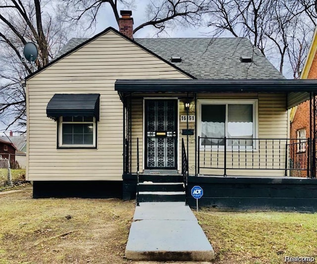 16191 Stoepel St, Detroit, MI 48221 - rear view of house with a shingled roof and a chimney