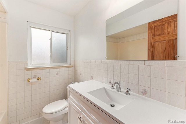 26809 Bonnie Ave, Warren, MI 48089 - bathroom featuring tile walls, toilet, vanity, and a wainscoted wall
