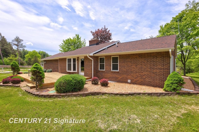 4769 S Fordney Rd, Hemlock, MI 48626 - rear view of property featuring a wooden deck, a yard, brick siding, a chimney, and a shingled roof