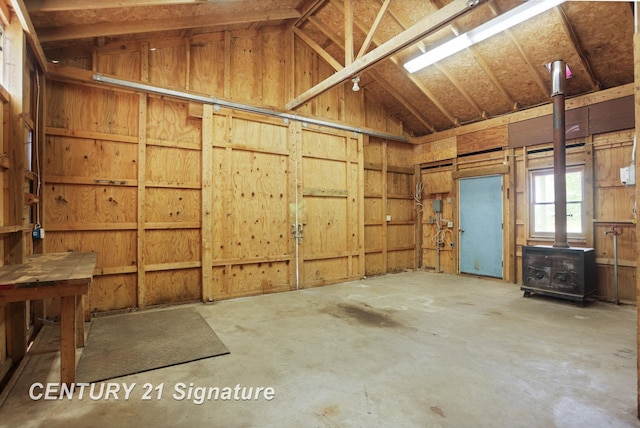 4769 S Fordney Rd, Hemlock, MI 48626 - garage featuring a wood stove