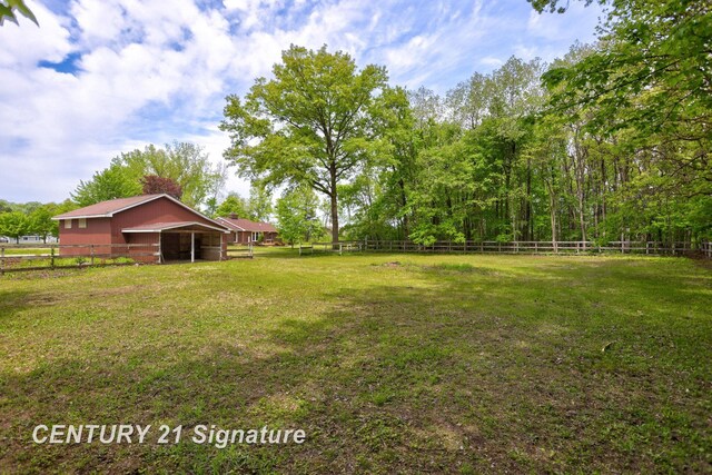 4769 S Fordney Rd, Hemlock, MI 48626 - view of yard featuring an outdoor structure and an exterior structure