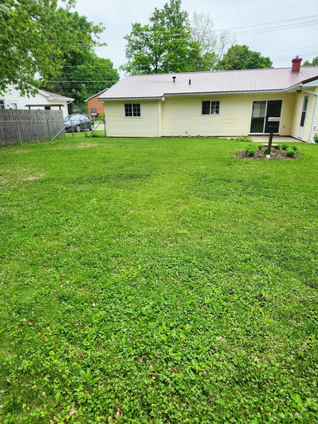 179 W State St, Coldwater, MI 49036 - rear view of house with a metal roof