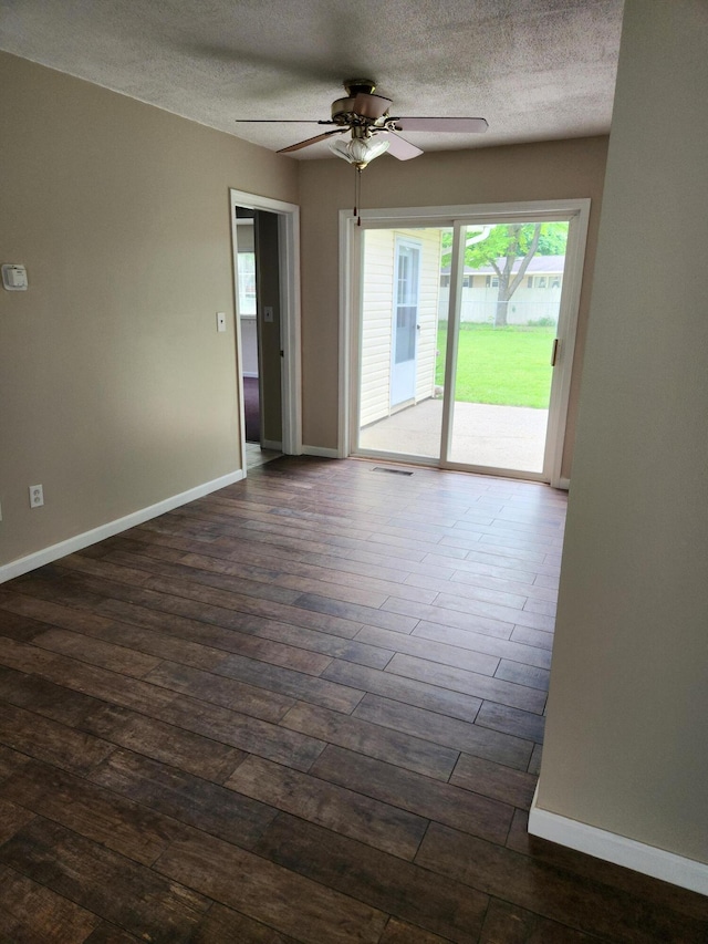 179 W State St, Coldwater, MI 49036 - spare room with dark wood-style flooring, a textured ceiling, and a ceiling fan