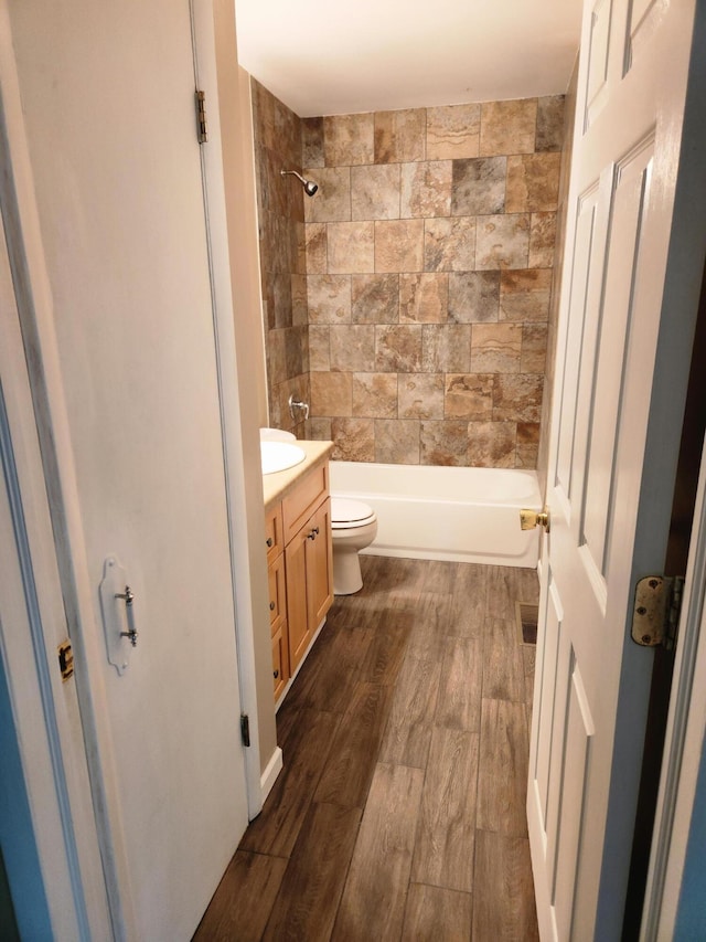 179 W State St, Coldwater, MI 49036 - bathroom featuring vanity, wood finished floors, and washtub / shower combination