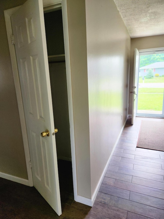 179 W State St, Coldwater, MI 49036 - hall with a textured ceiling and dark wood finished floors