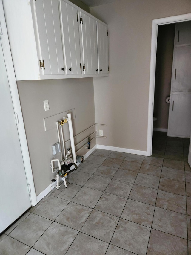 179 W State St, Coldwater, MI 49036 - washroom featuring hookup for a gas dryer and light tile patterned floors