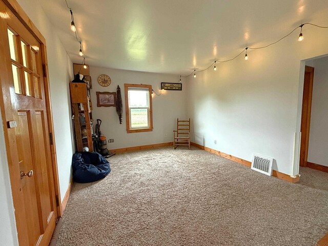 11250 Bristol Rd, Lennon, MI 48449 - unfurnished room featuring carpet flooring, baseboards, and rail lighting