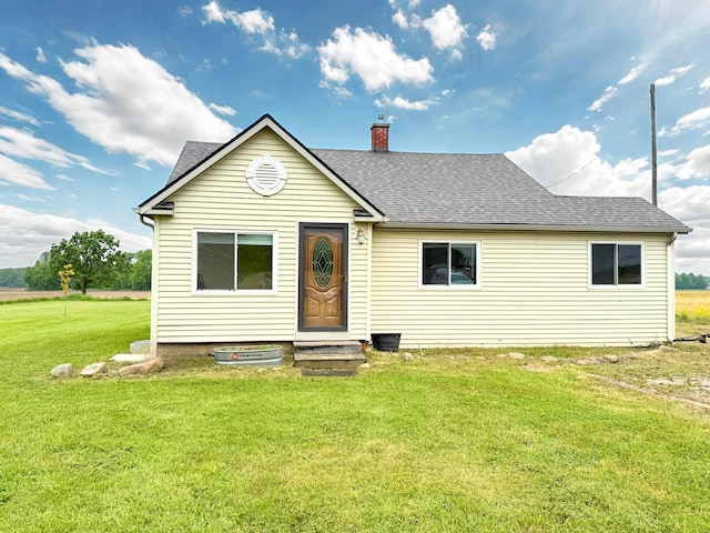 11250 Bristol Rd, Lennon, MI 48449 - view of front of property with roof with shingles, a front lawn, and a chimney