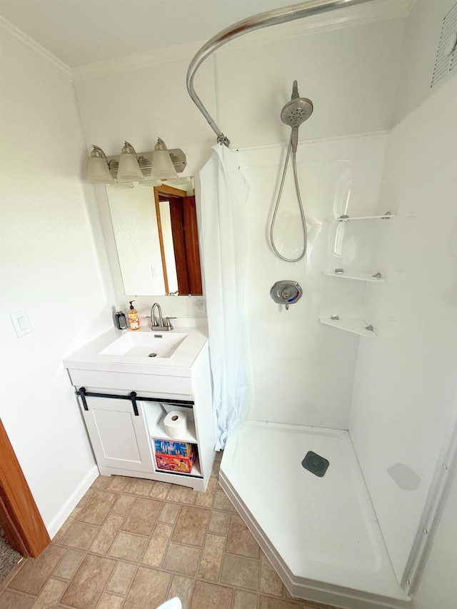 11250 Bristol Rd, Lennon, MI 48449 - bathroom with a shower stall, vanity, baseboards, stone finish flooring, and crown molding