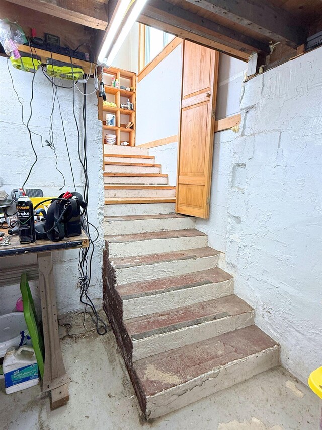 11250 Bristol Rd, Lennon, MI 48449 - stairs featuring unfinished concrete flooring